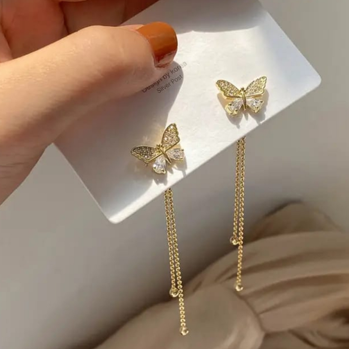 Gold Tone Crystal Butterfly Tassel Earrings