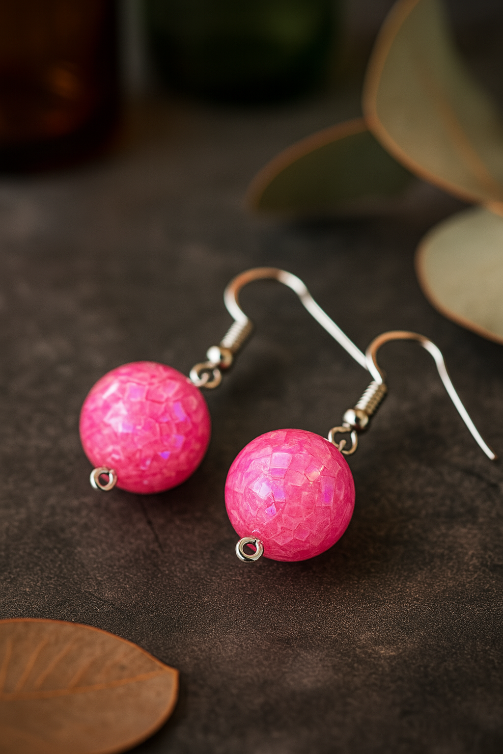 Bright pink handcrafted dangle earrings featuring iridescent mosaic bead design