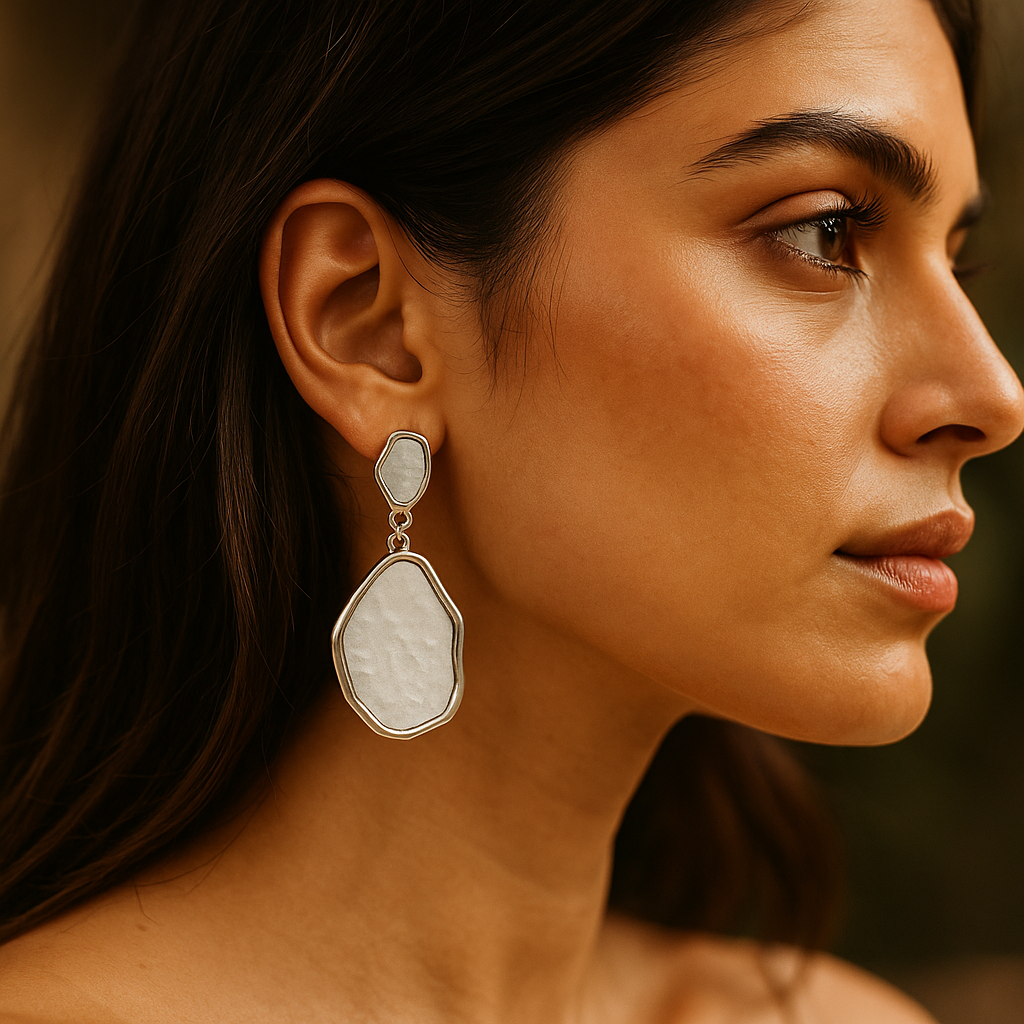 Contemporary anti-tarnish dangle earrings featuring raw finish white stones in abstract silver outlines – modern fashion accessory