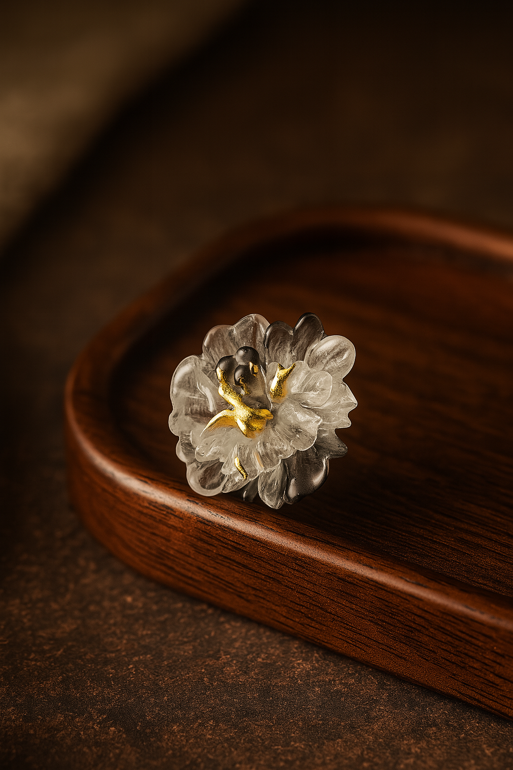 Decorative ring with floral design on a wooden surface