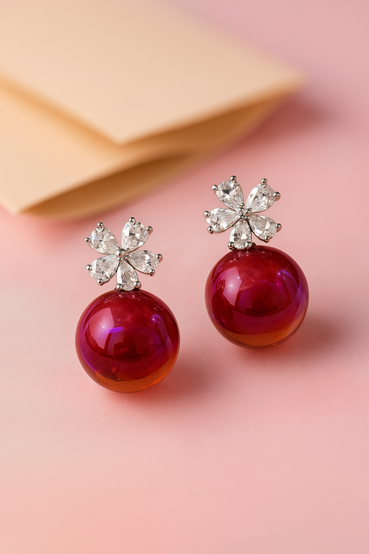 Elegant anti-rust earrings featuring deep ruby red pearls and sparkling crystal flower design