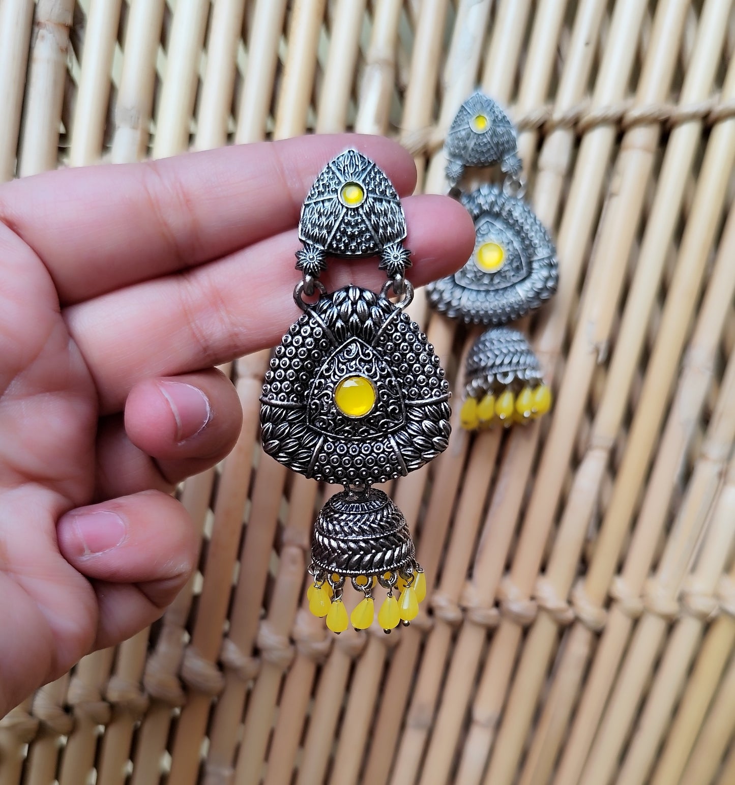 Black Metal Oxidized Jhumka Earrings with Yellow Accents - KurlyWurly.store