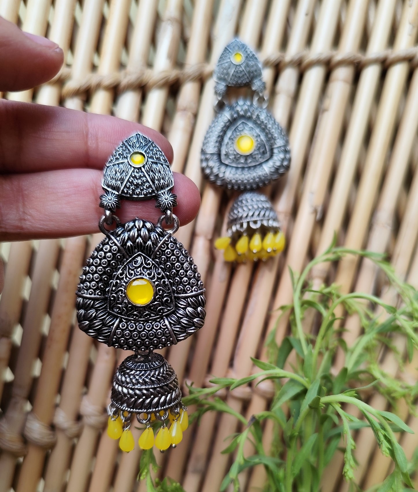 Black Metal Oxidized Jhumka Earrings with Yellow Accents - KurlyWurly.store