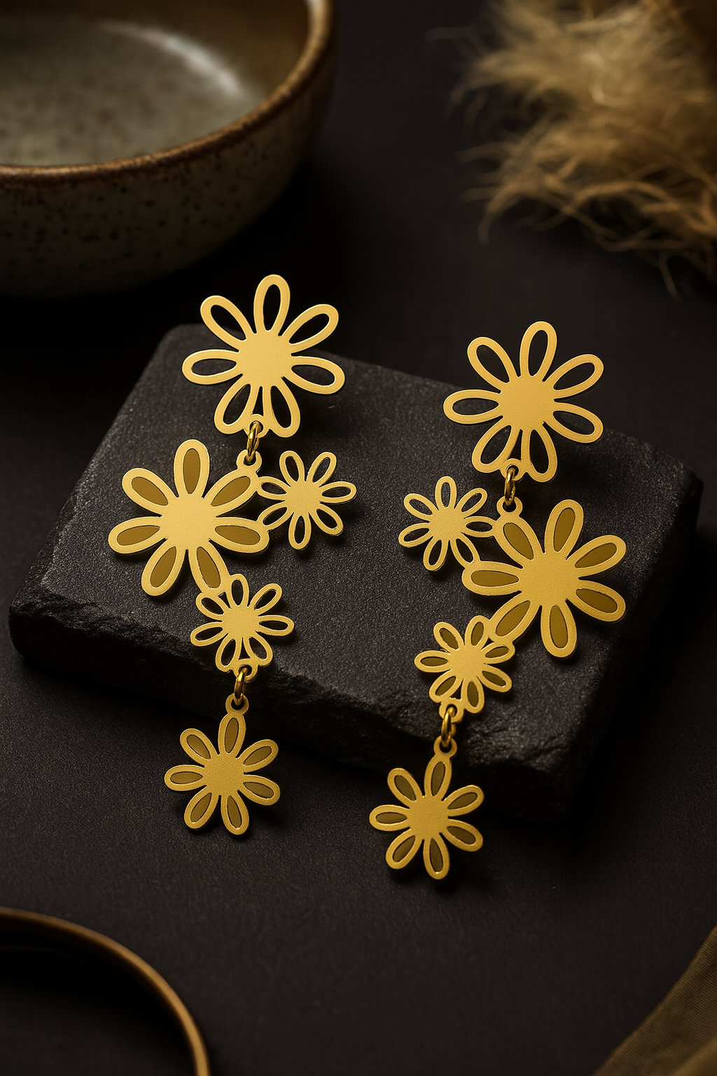 Layered floral gold earrings with cascading daisy motifs, lightweight festive jewelry with matte finish