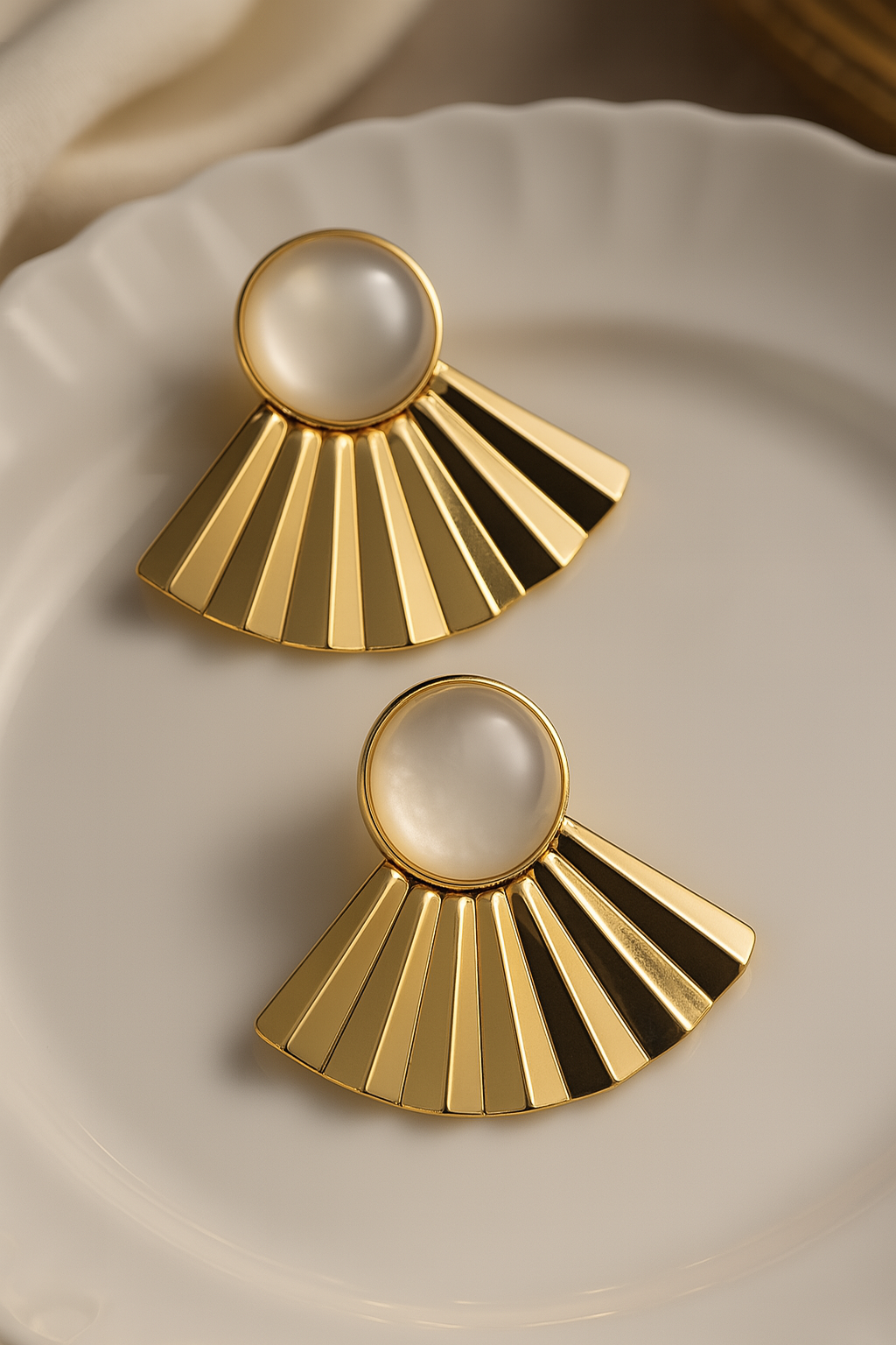 Modern gold plated radiate earrings with a milky white stone top, elegant geometric fashion accessories
