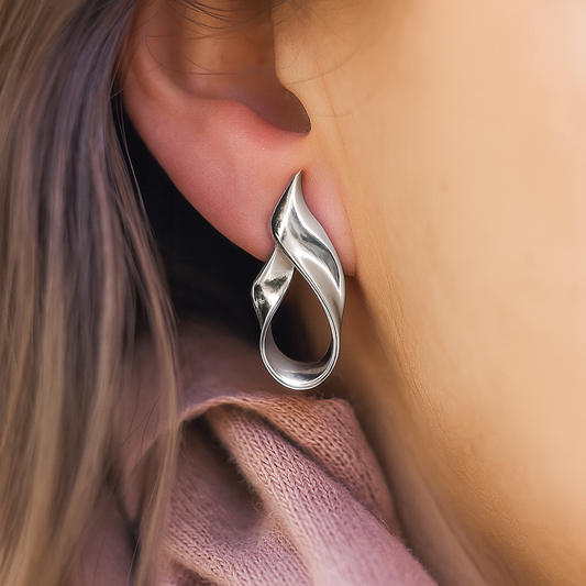 Modern twisted teardrop silver earrings featuring high-polish anti-rust finish