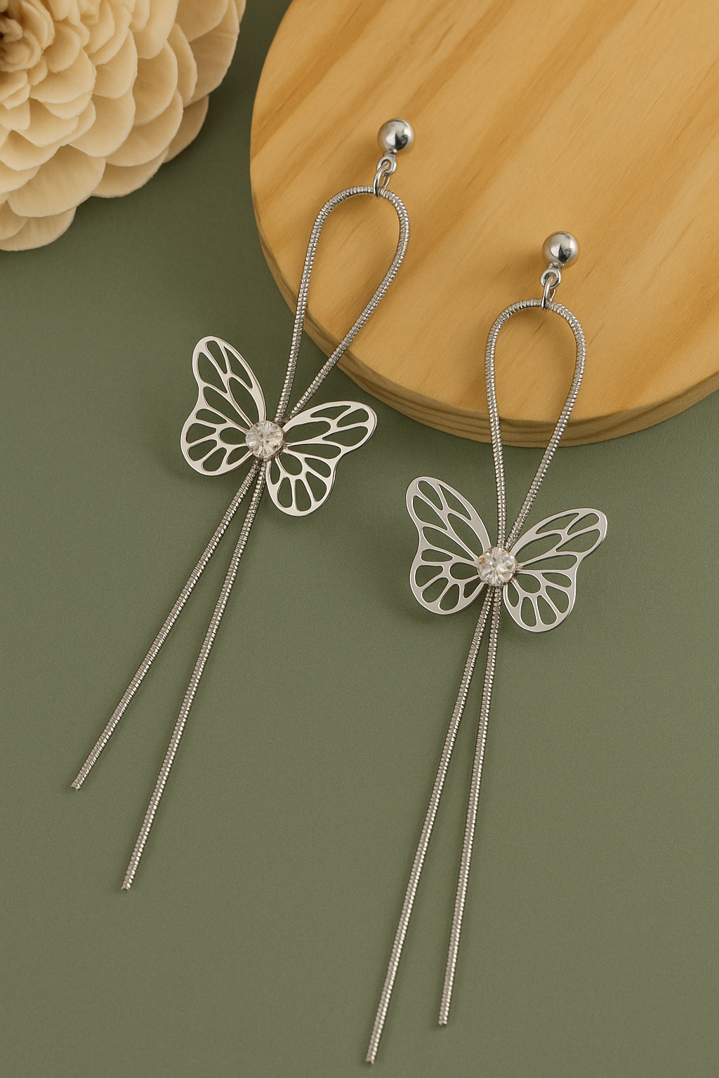 Silver butterfly dangle earrings with crystal center and anti-tarnish long chain design.