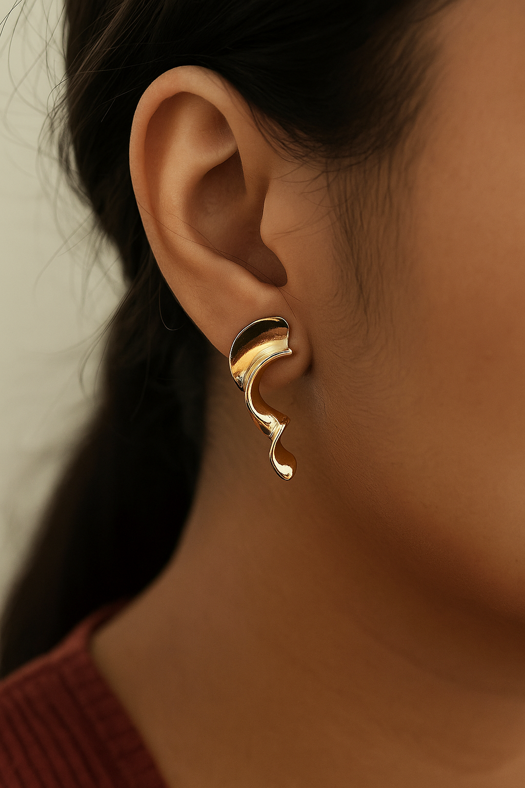 Statement anti-tarnish gold hoops with artistic fluid silhouette for fashion-forward styling