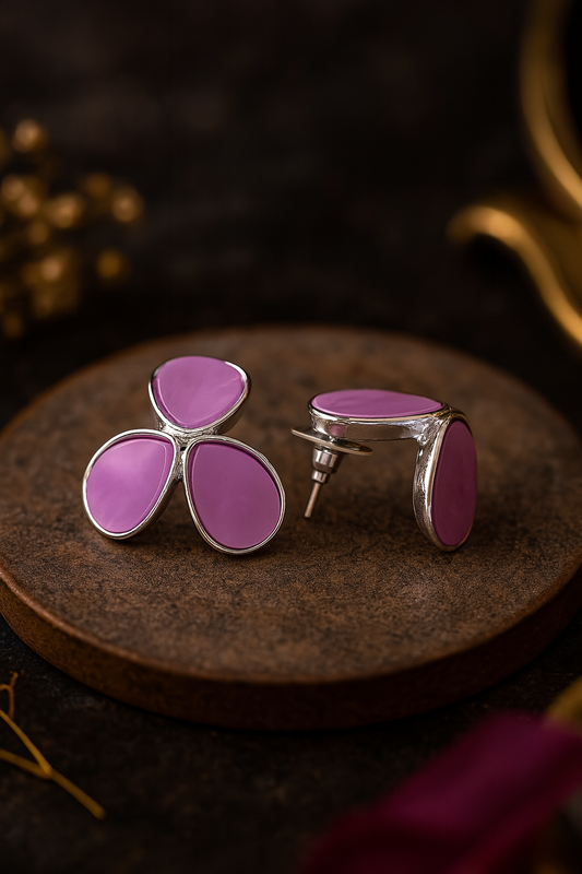Tri-petal purple enamel anti-tarnish stud earrings with silver outline on rustic display