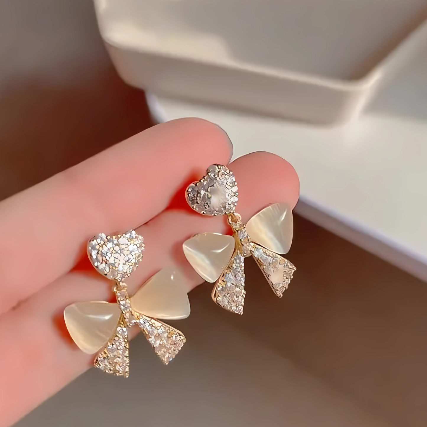 Gold Tone Crystal Heart Iridescent Bow Dangles