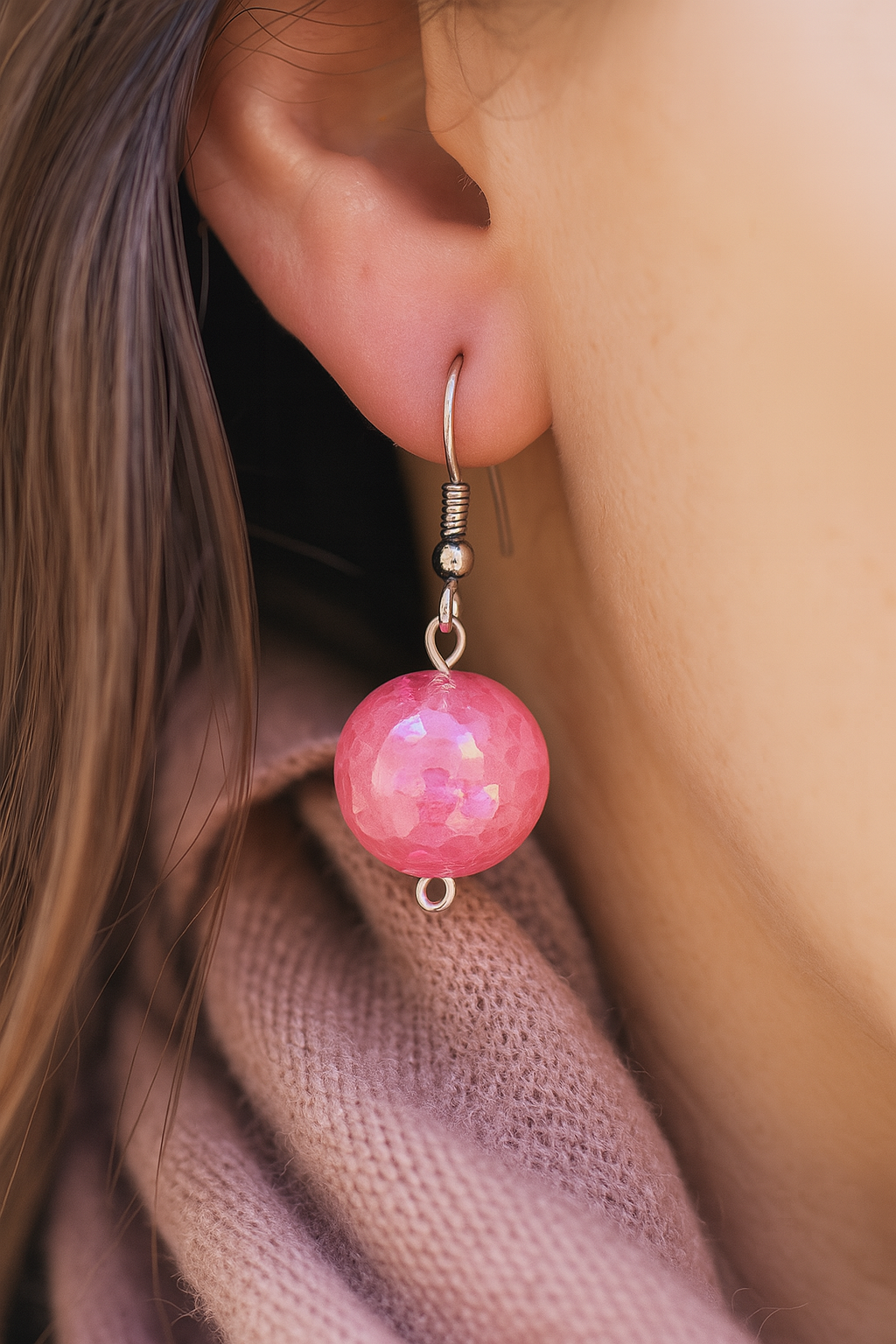 Boho-style handmade earrings with sparkly pink crystal-effect resin balls and metal findings