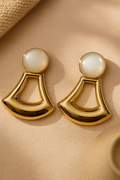 Polished gold geometric fan-shaped dangle earrings with white cabochon top, modern art deco style jewelry