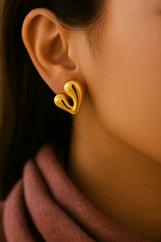 Contemporary V-heart gold stud earrings in high-polish finish, modern handcrafted accessory for weddings, Raksha Bandhan, and special occasions