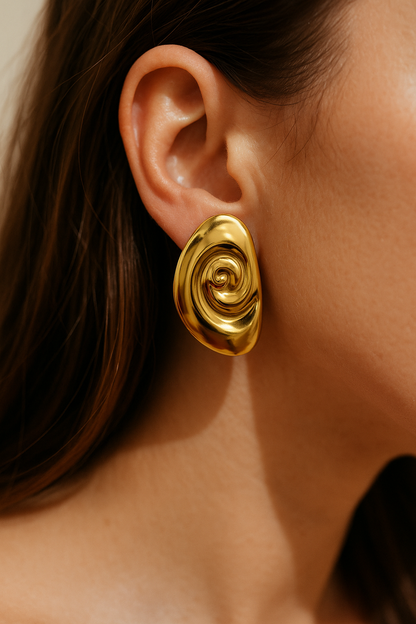 High-shine gold oval earring with abstract twisted design, bold sculptural jewelry for festive and party wear