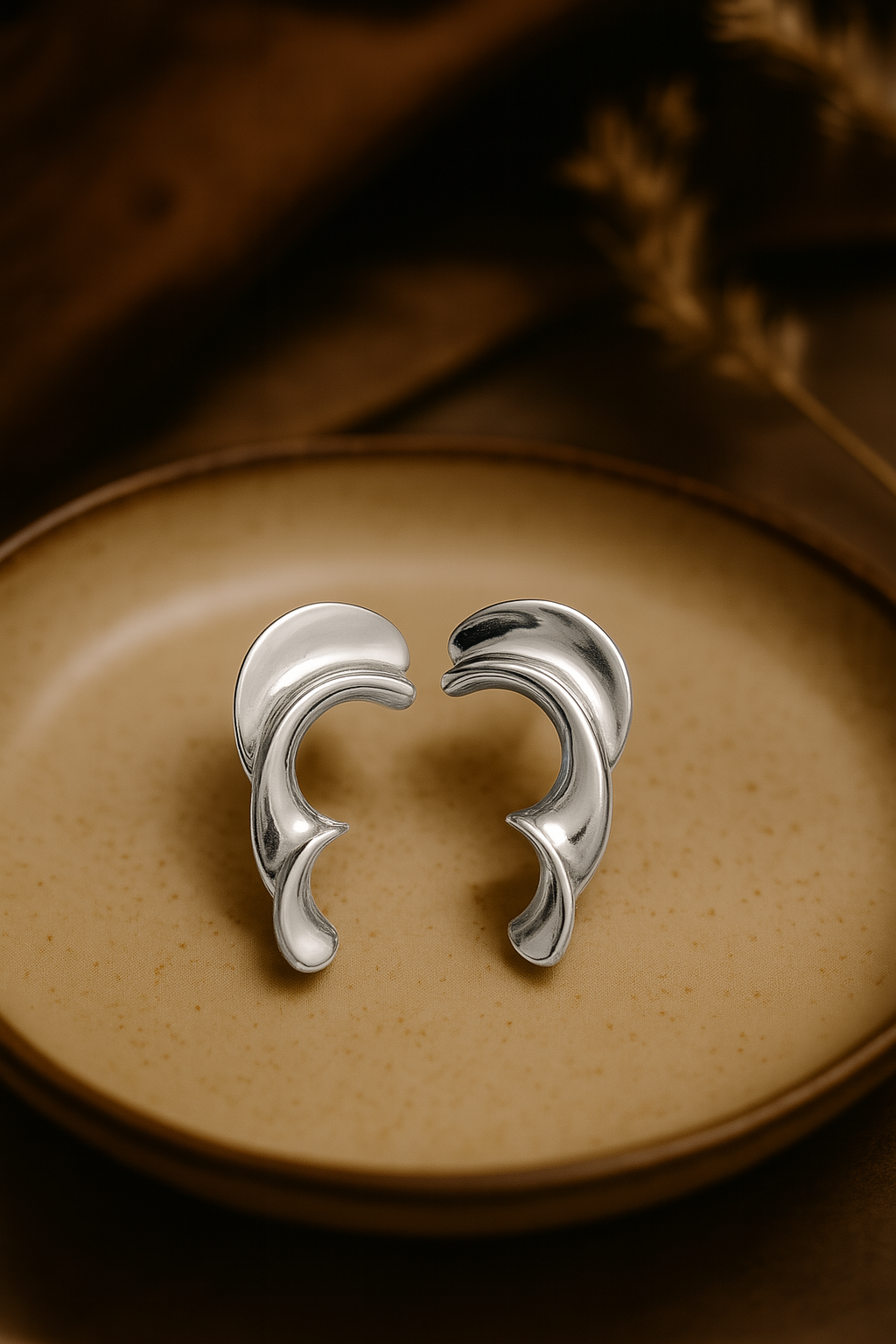 Contemporary silver-plated anti-tarnish hoop earrings with sculptural wave-inspired design