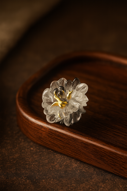 Decorative ring with floral design on a wooden surface