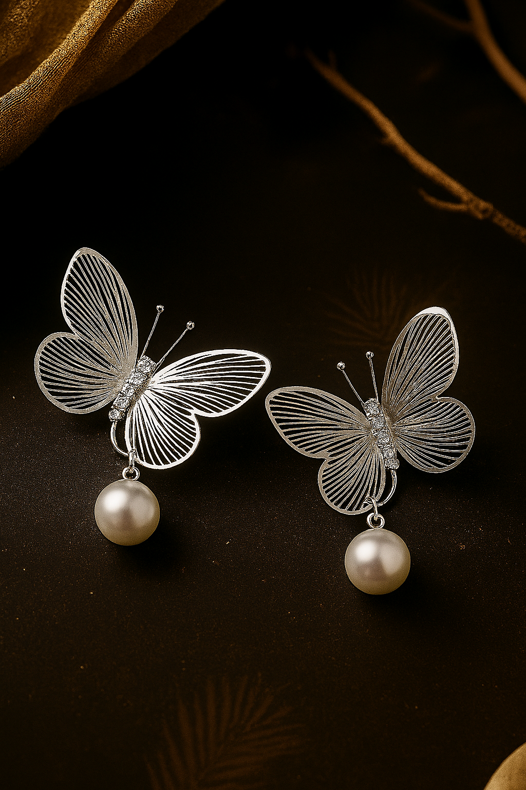 Delicate silver tone butterfly earrings with sparkling rhinestones and imitation pearls, timeless fashion accessories