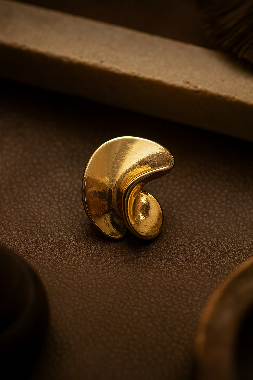 Designer statement gold earrings featuring abstract spiral form and anti-tarnish coating