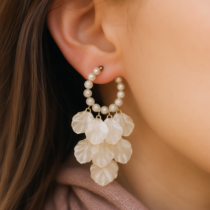 Gold-toned hoop earrings adorned with pearls and cascading shell petals – perfect for festive and vacation looks.