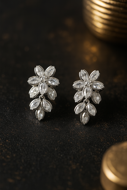 Elegant anti-tarnish stud earrings in flower shape with clear zircon detailing – timeless party wear accessory.