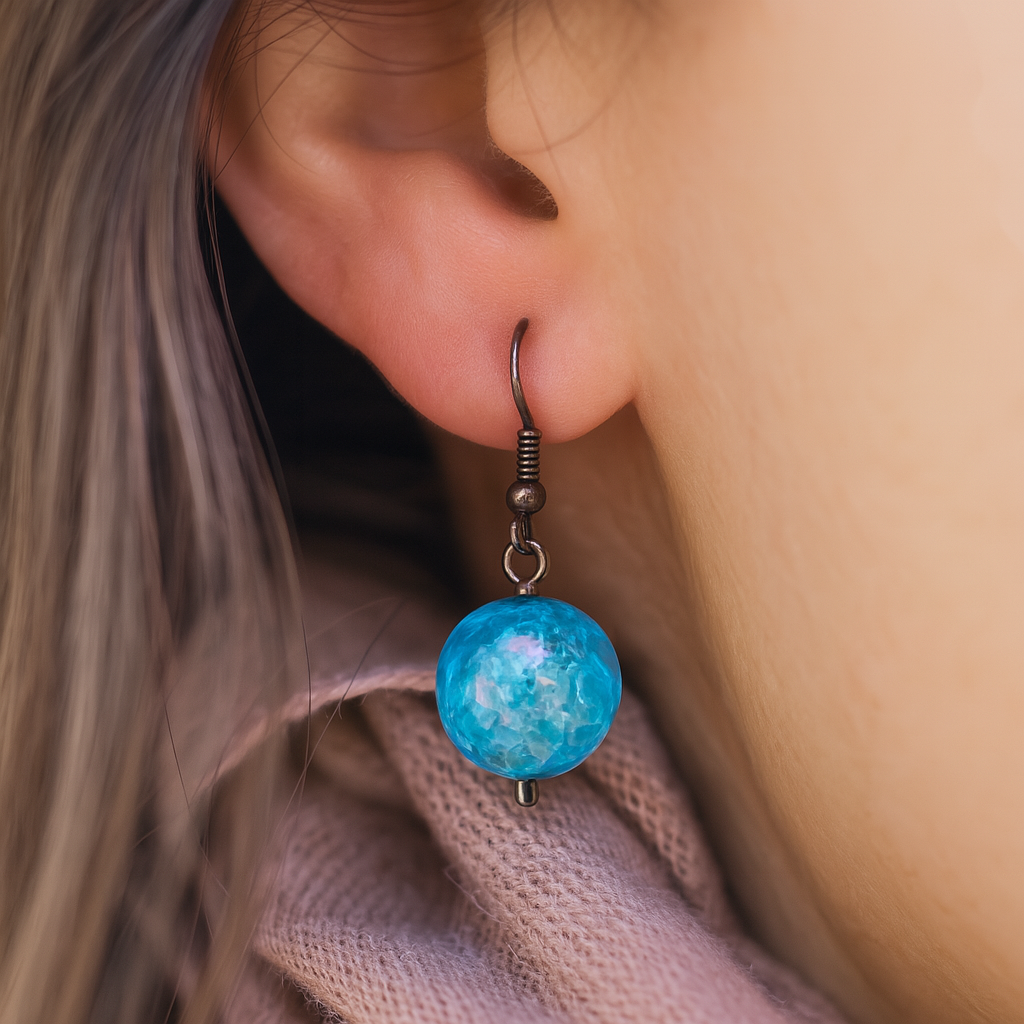 Elegant handcrafted earrings featuring sparkling ocean blue crystal-like spheres