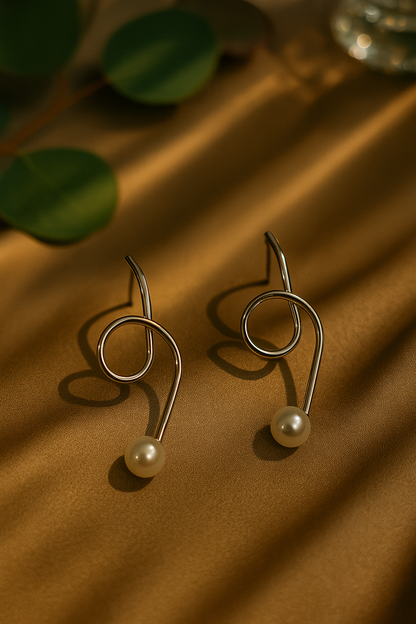 Sleek silver swirl earrings with pearls, minimalist designer accessory ideal for festive occasions, office wear, and gifting