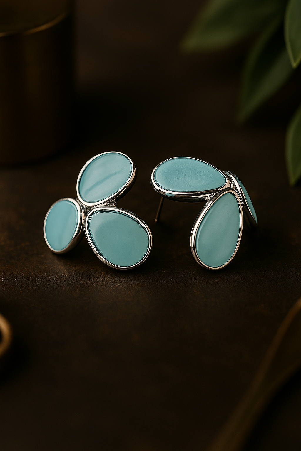 Elegant turquoise blue anti-tarnish stud earrings with abstract teardrop design and silver border