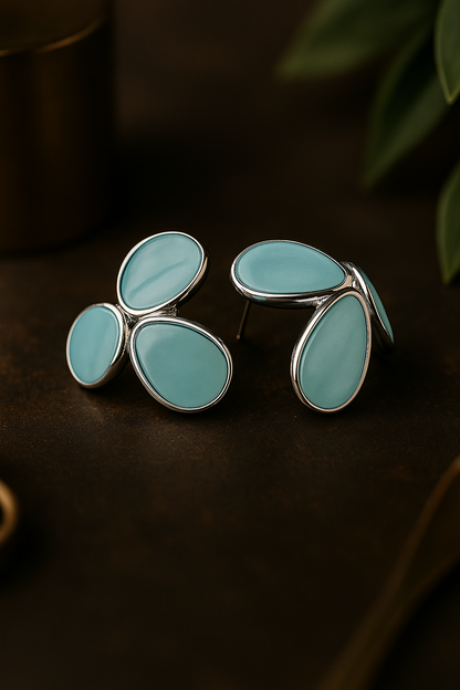 Elegant turquoise blue anti-tarnish stud earrings with abstract teardrop design and silver border