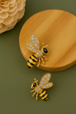 Gold-plated bee-shaped anti-tarnish earrings with crystal wings and black enamel detailing