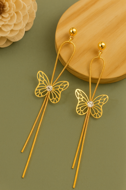 Gold-tone anti-tarnish butterfly earrings with long dangle chains and crystal centerpiece.