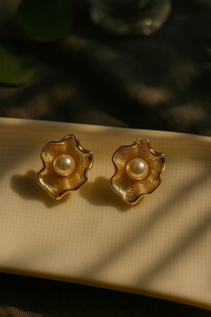 Gold wavy anti-tarnish stud earrings with pearl center – elegant floral design for festive and bridal wear.