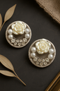 Handmade round stud earrings with pearl rose centerpiece, crystal accents, and faux pearls