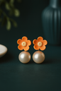 Bright orange flower drop earrings with yellow center and white pearl, cheerful floral jewelry for women
