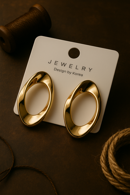 Minimalist gold oval earrings with sculpted twist design, Korean-inspired statement jewelry for party and everyday wear