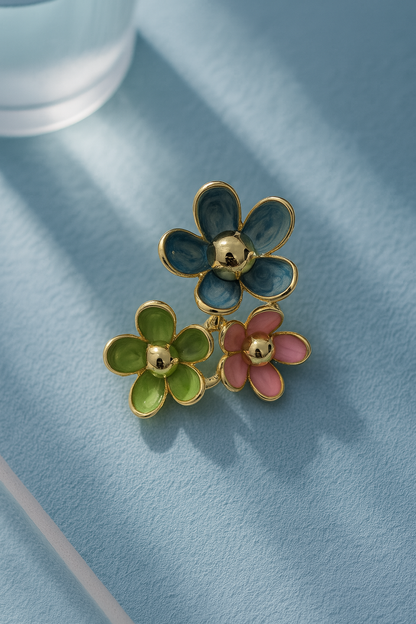 Stylish three-flower stud earrings with blue, pink, and green enamel, gold-tone accents