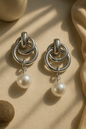 Polished silver anti-tarnish earrings with interlocking hoops and pearl drop – modern statement jewelry for women