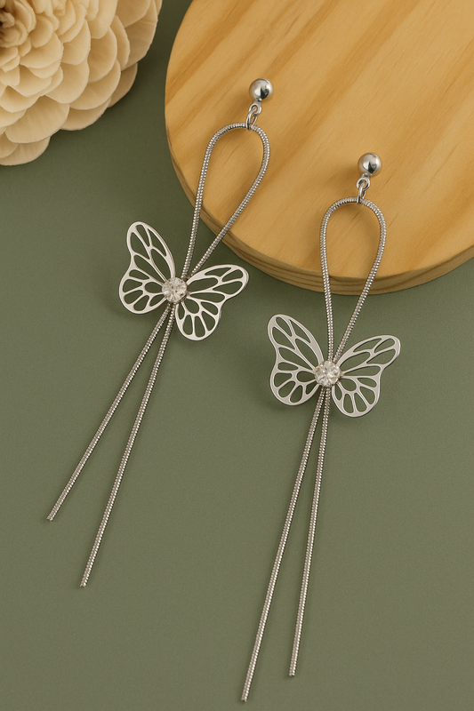 Silver butterfly dangle earrings with crystal center and anti-tarnish long chain design.