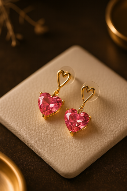 Sparkling pink heart drop earrings with gold outline – elegant statement jewelry for parties and gifting