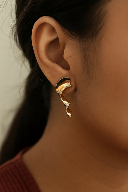 Statement anti-tarnish gold hoops with artistic fluid silhouette for fashion-forward styling