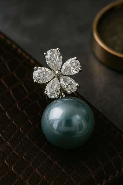 Statement anti-tarnish stud earrings with blue pearls and diamond-cut floral crystal design