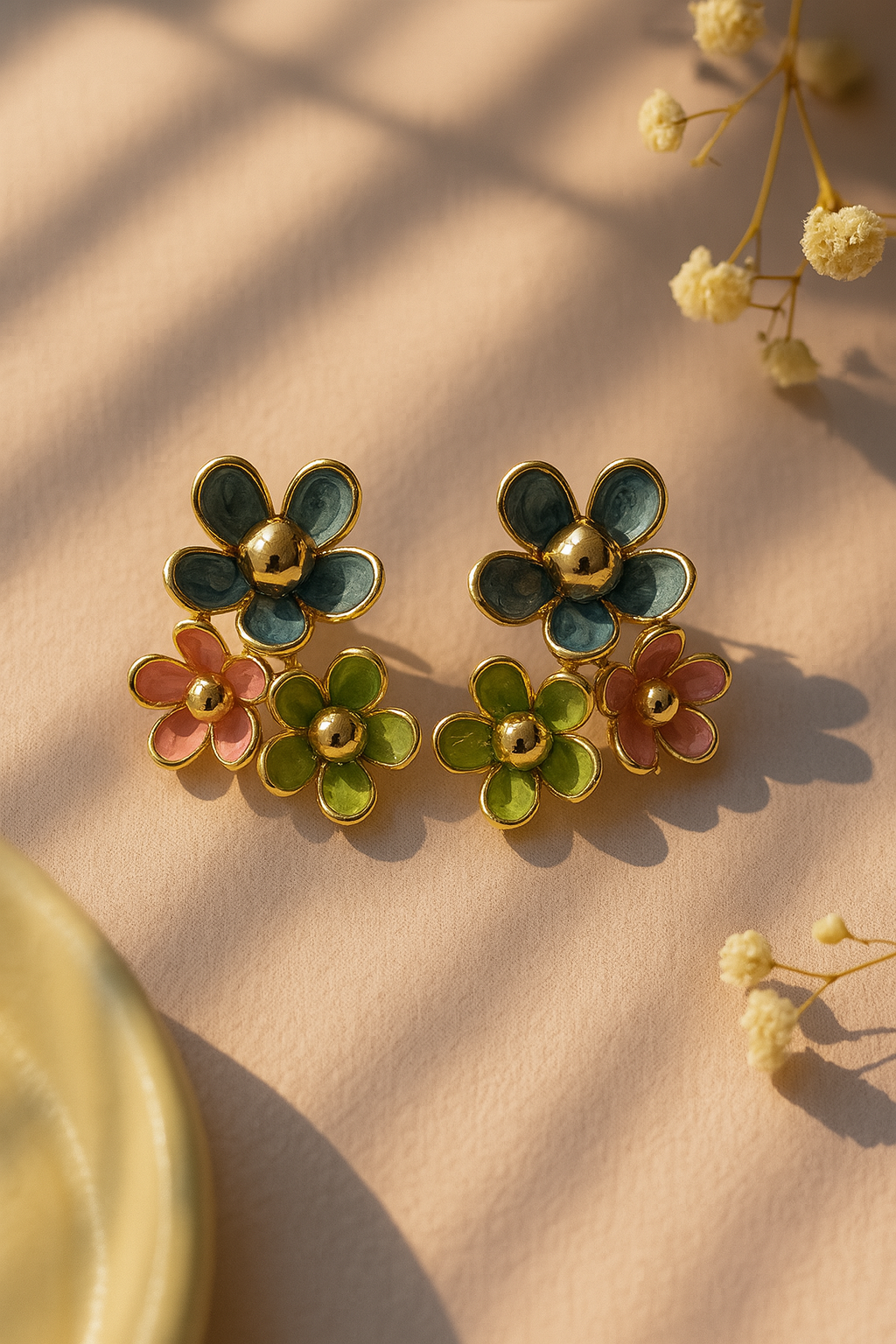 Colorful enamel floral stud earrings with blue, green, and pink petals – handcrafted gold-plated statement jewelry