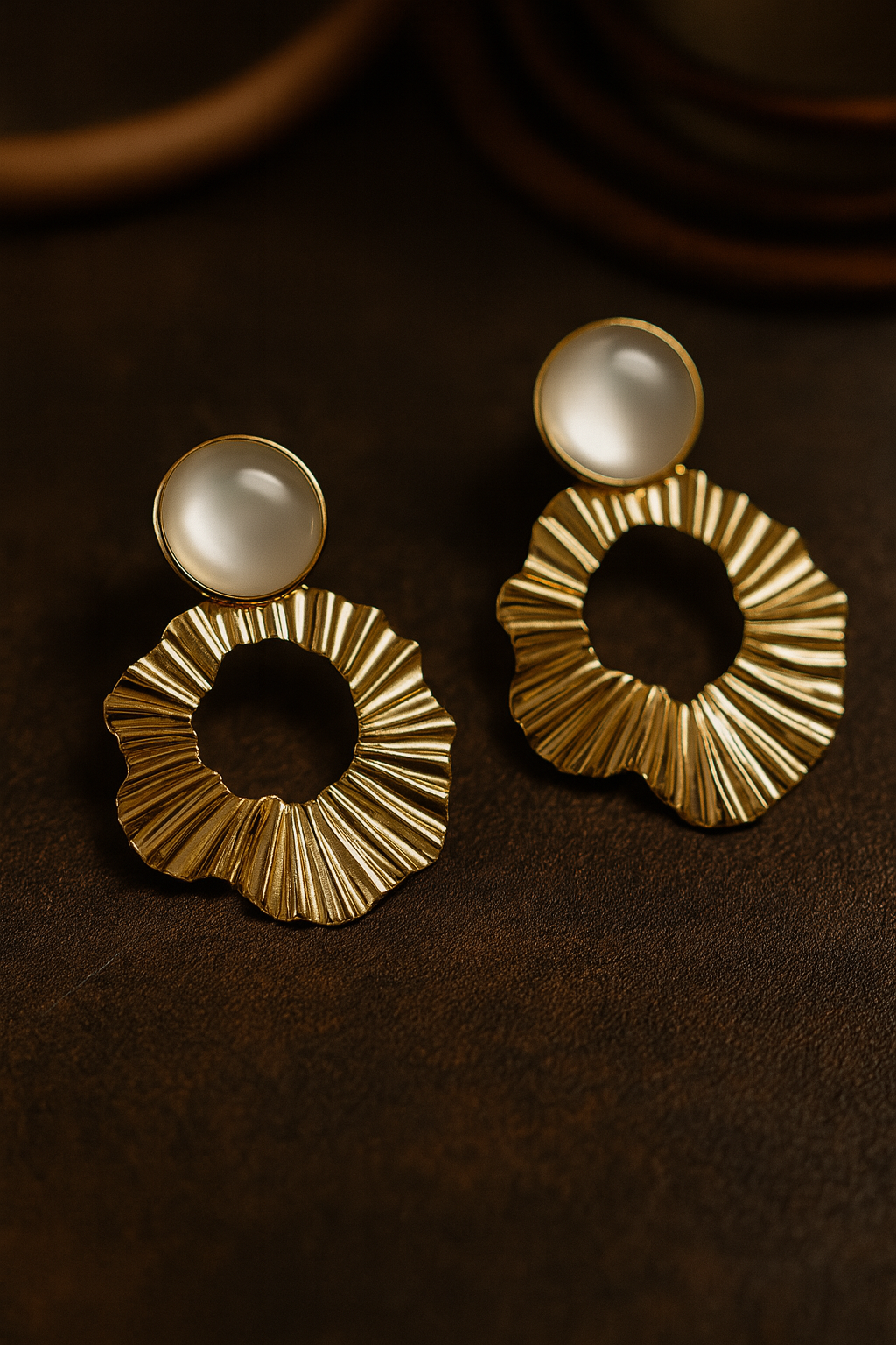 Textured gold tone circular drop earrings with milky white cabochon, contemporary fashion accessory for women