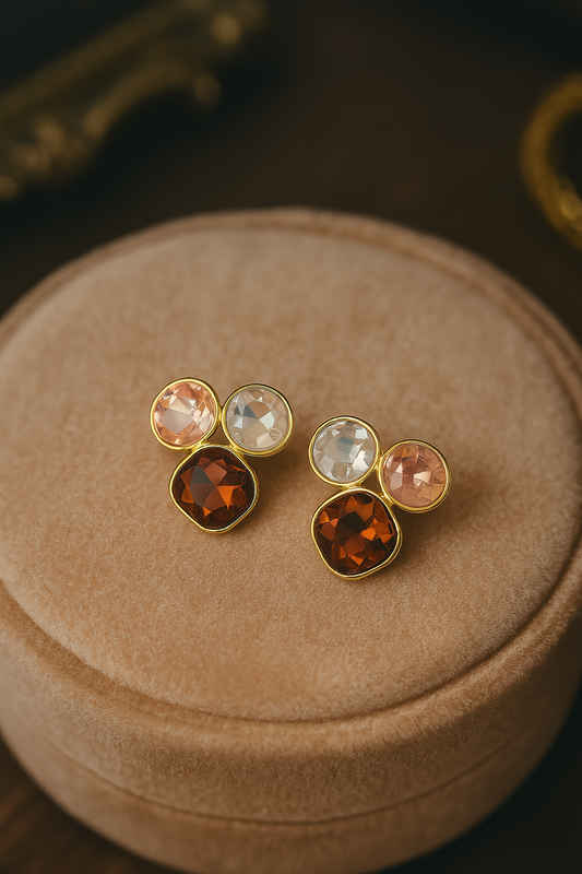 Tri-stone designer stud earrings with golden frame featuring amber, blush pink, and crystal gemstones